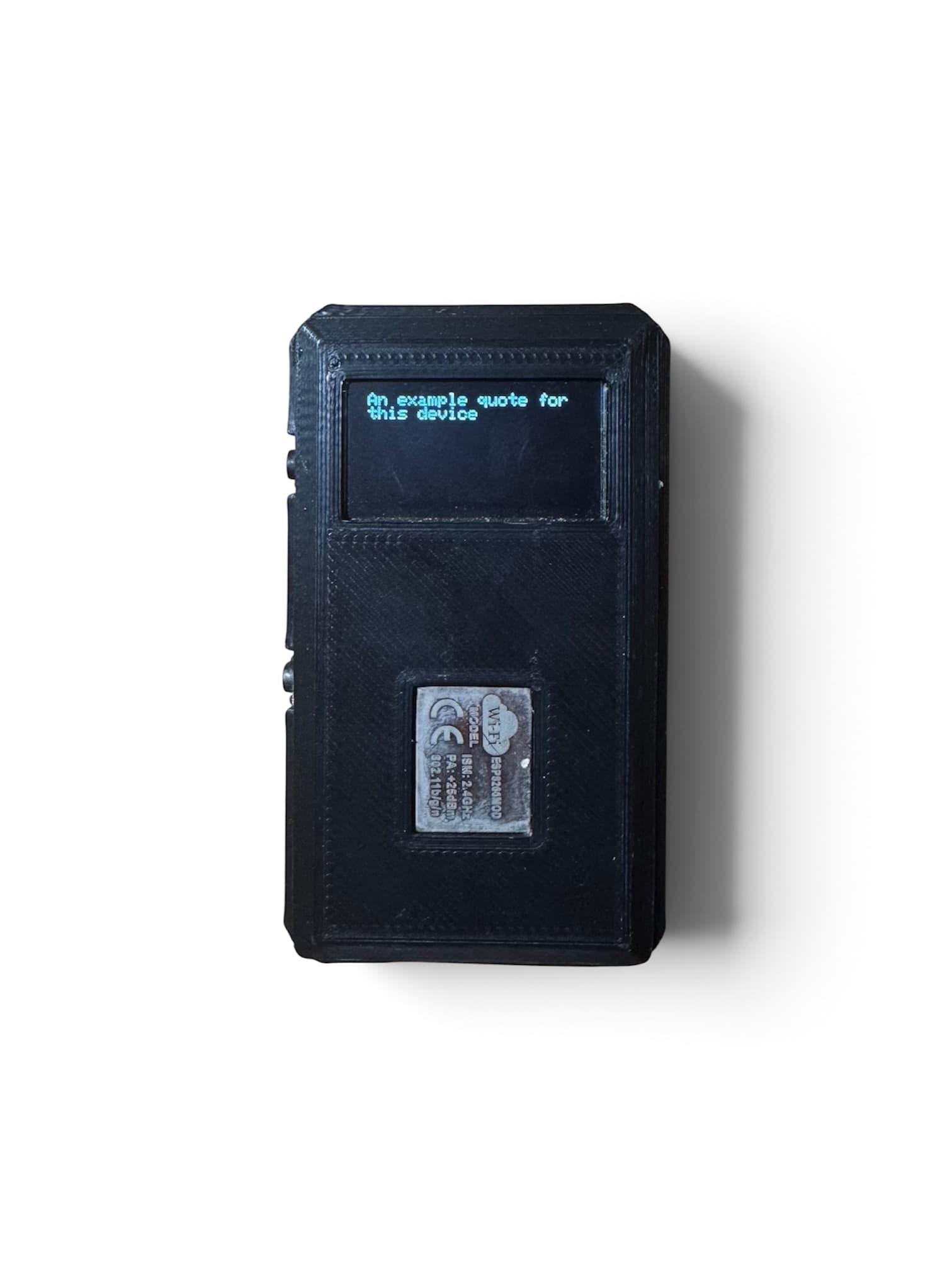 Pocket Quote in action, displaying an example quote on its screen in a black 3D-printed enclosure.